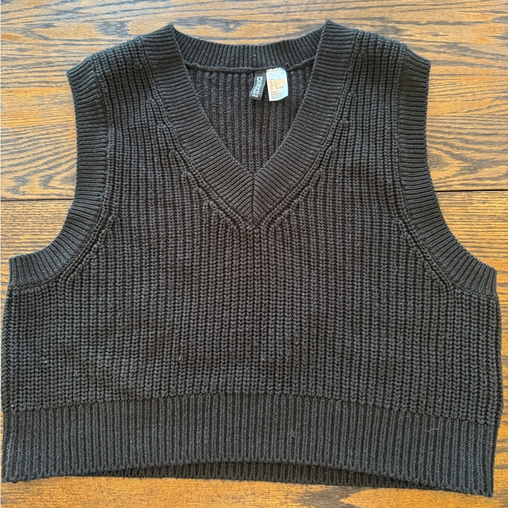 Large black knit sweater vest from H&M. Good condition.